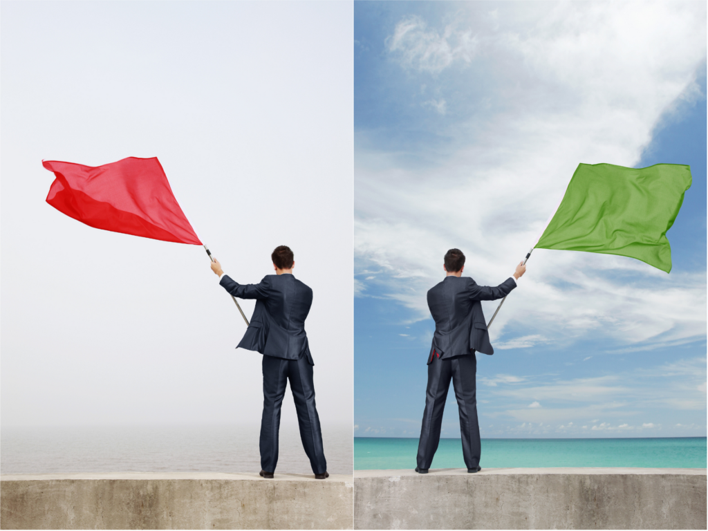 split photo showing the same person in two situations: waving a red flag on one side and a green flag on the other