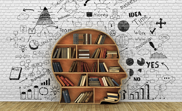 a bookcase the shape of a human head in profile, surrounded by doodles of business ideas
