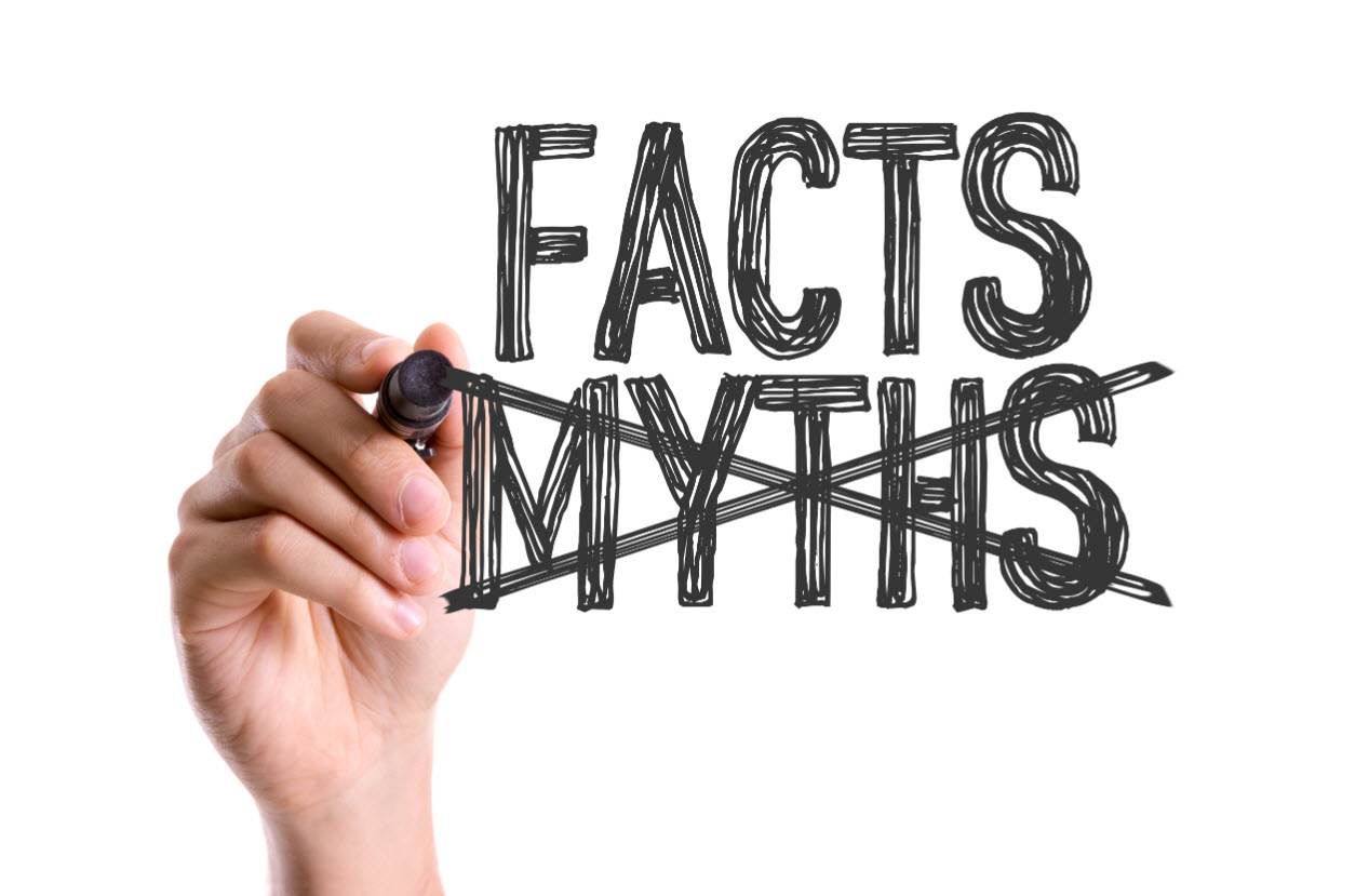 a hand holding a marker crosses out the word "myths" in favor of the word "facts"