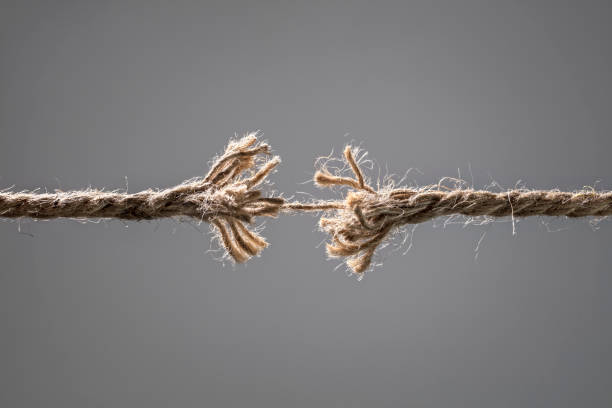 a frayed rope that is about to break because it's held by a single thread